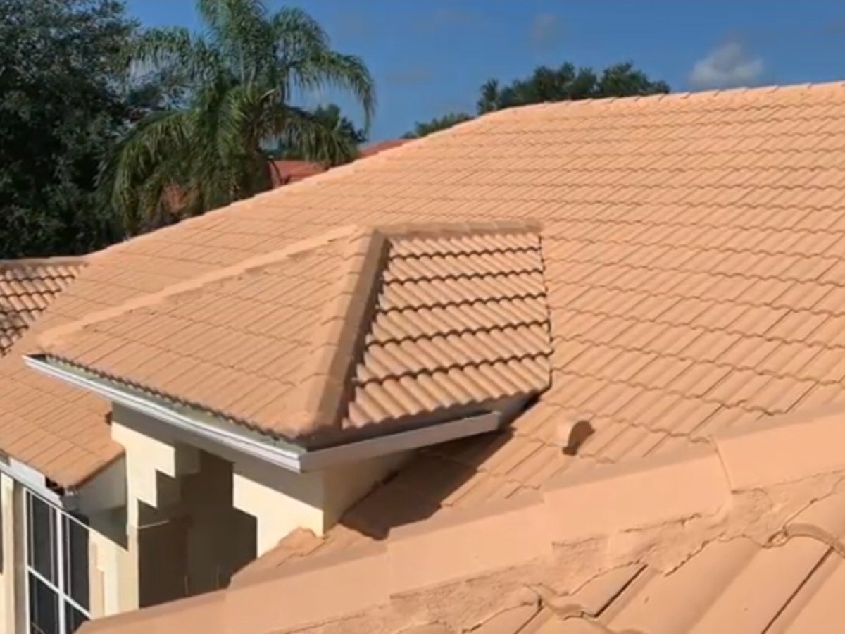 Terracotta barrel tile roof restored with a fresh coating